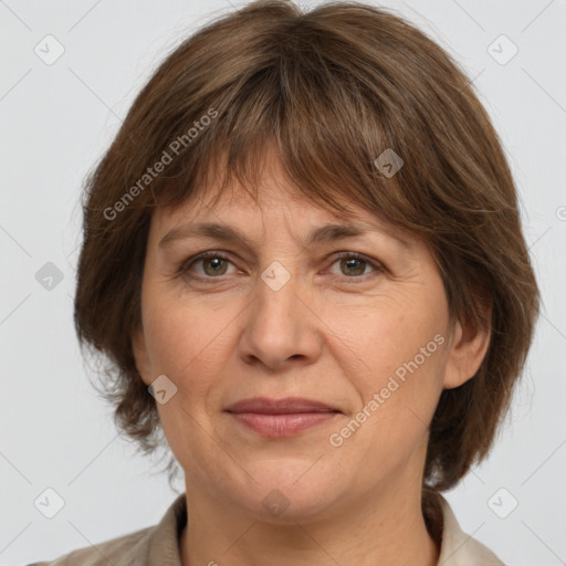 Joyful white adult female with medium  brown hair and grey eyes