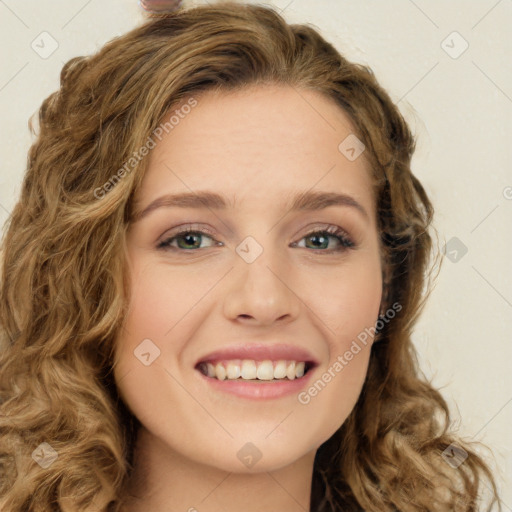 Joyful white young-adult female with long  brown hair and green eyes