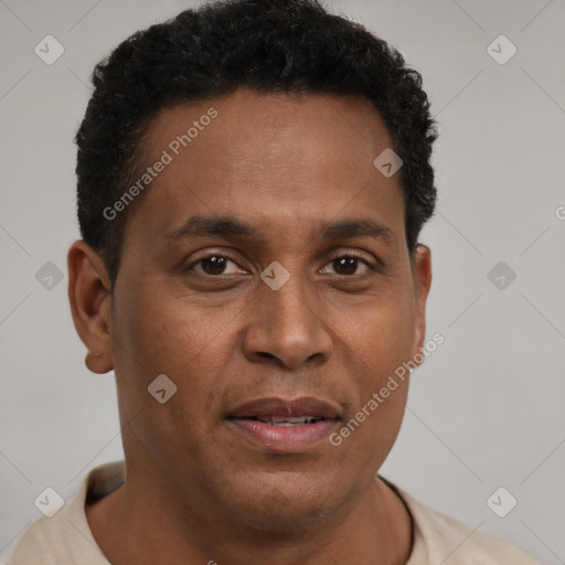 Joyful black young-adult male with short  brown hair and brown eyes