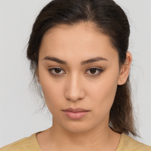 Neutral white young-adult female with medium  brown hair and brown eyes