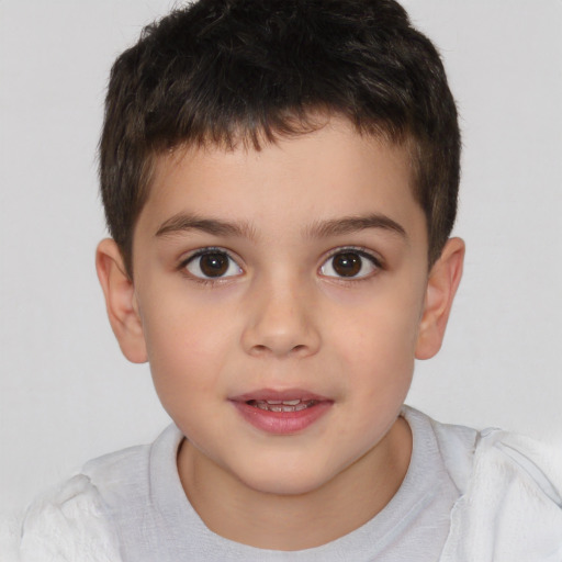 Joyful white child male with short  brown hair and brown eyes