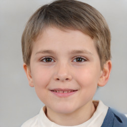 Joyful white child male with short  brown hair and brown eyes