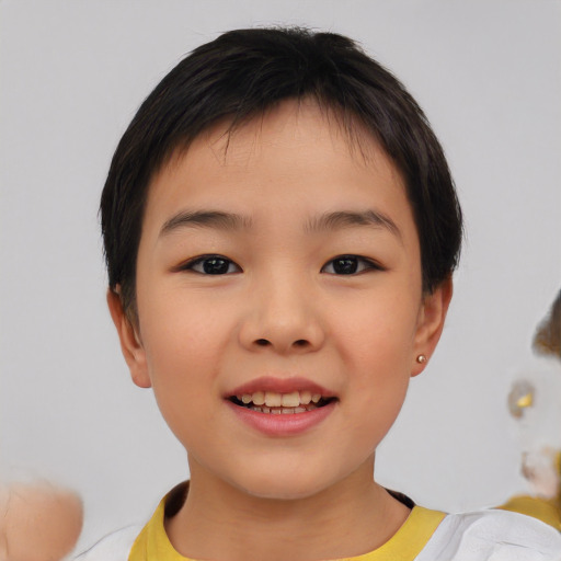 Joyful asian child female with short  brown hair and brown eyes