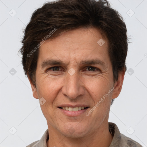 Joyful white adult male with short  brown hair and brown eyes