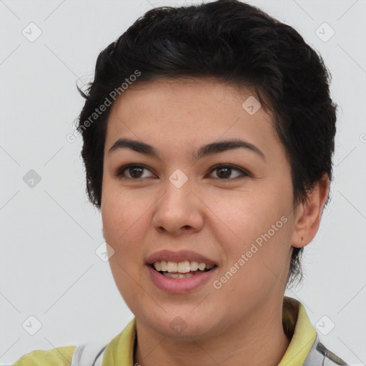 Joyful asian young-adult female with short  brown hair and brown eyes