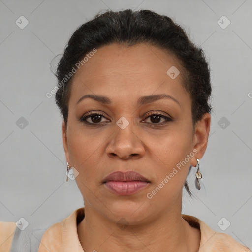 Joyful latino adult female with short  brown hair and brown eyes