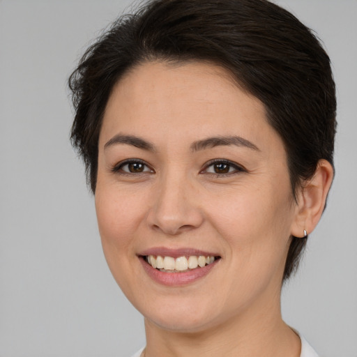 Joyful white young-adult female with medium  brown hair and brown eyes