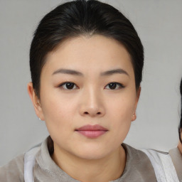 Neutral asian young-adult female with medium  brown hair and brown eyes