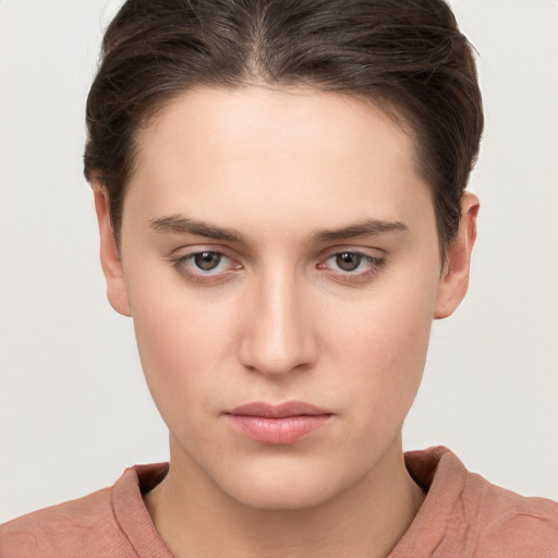 Neutral white young-adult female with short  brown hair and brown eyes