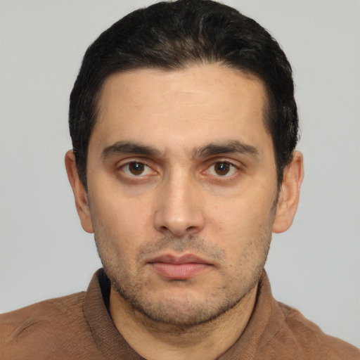 Neutral white young-adult male with short  black hair and brown eyes