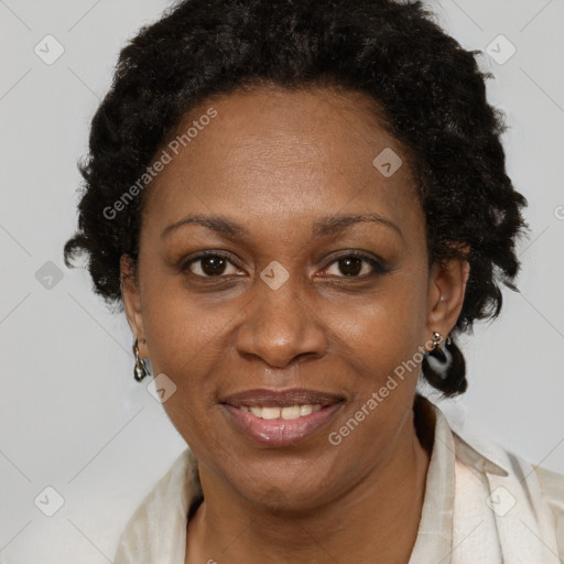 Joyful black adult female with short  brown hair and brown eyes