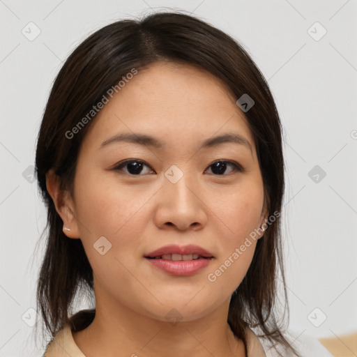 Joyful asian young-adult female with medium  brown hair and brown eyes