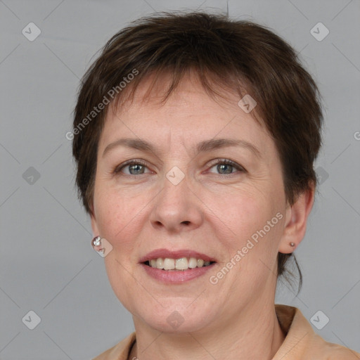 Joyful white adult female with short  brown hair and grey eyes