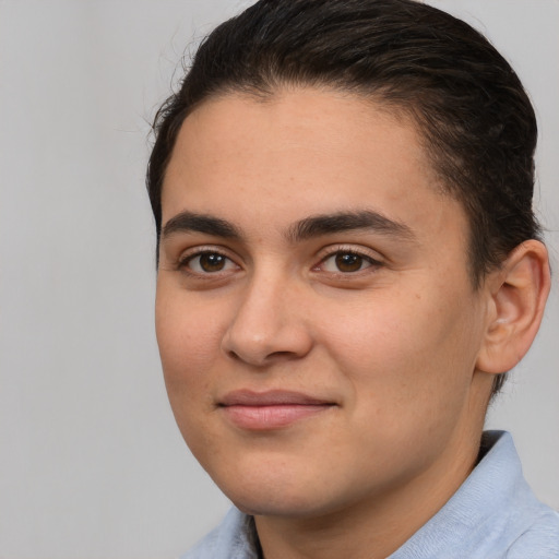 Joyful white young-adult male with medium  brown hair and brown eyes