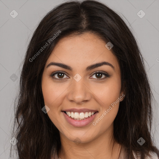 Joyful latino young-adult female with long  brown hair and brown eyes