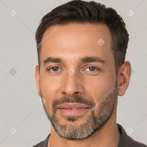 Joyful white adult male with short  brown hair and brown eyes