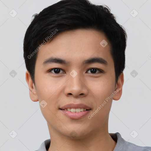 Joyful asian young-adult male with short  black hair and brown eyes