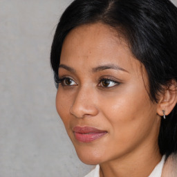 Joyful latino young-adult female with medium  black hair and brown eyes