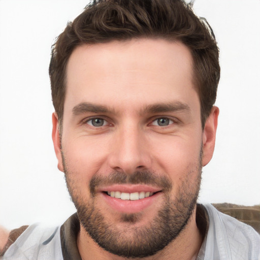 Joyful white young-adult male with short  brown hair and brown eyes