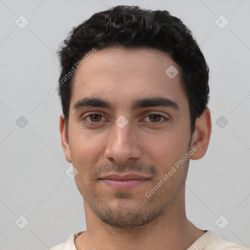 Joyful white young-adult male with short  black hair and brown eyes