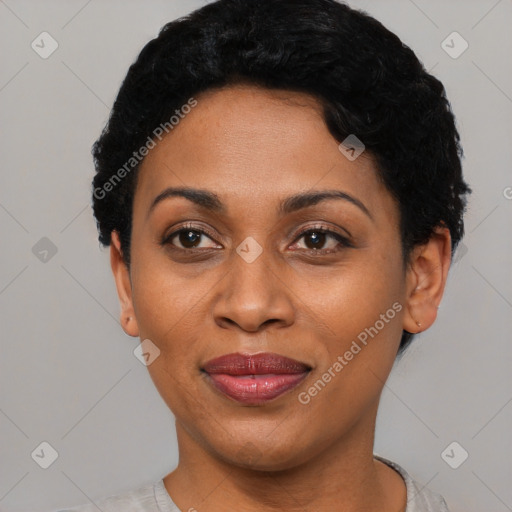 Joyful black adult female with short  black hair and brown eyes