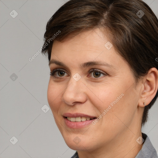 Joyful white adult female with medium  brown hair and brown eyes