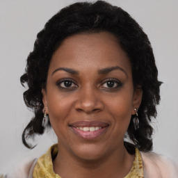Joyful black young-adult female with medium  black hair and brown eyes