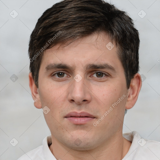 Neutral white young-adult male with short  brown hair and brown eyes