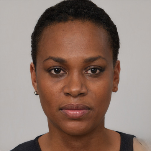 Neutral black young-adult female with short  black hair and brown eyes
