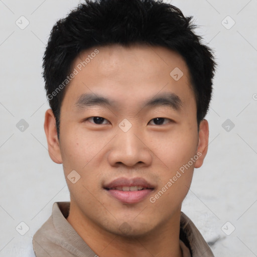 Joyful asian young-adult male with short  black hair and brown eyes