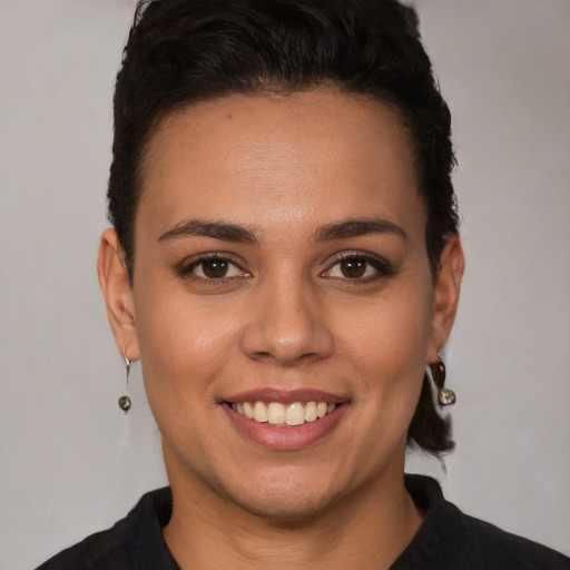 Joyful white young-adult female with short  brown hair and brown eyes