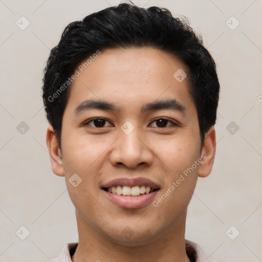 Joyful latino young-adult male with short  black hair and brown eyes