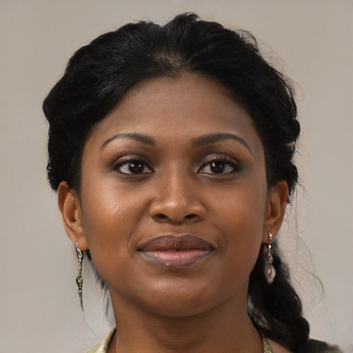 Joyful black young-adult female with medium  black hair and brown eyes