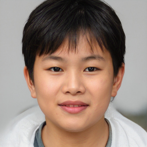 Joyful asian child female with short  brown hair and brown eyes