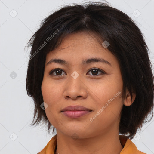 Joyful asian young-adult female with medium  brown hair and brown eyes