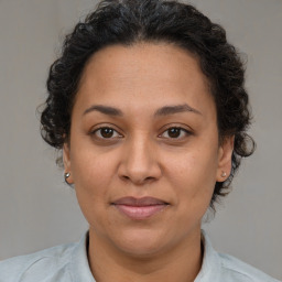 Joyful white adult female with short  brown hair and brown eyes