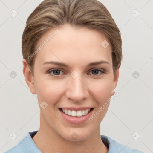 Joyful white young-adult female with short  brown hair and grey eyes