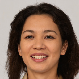 Joyful white adult female with medium  brown hair and brown eyes