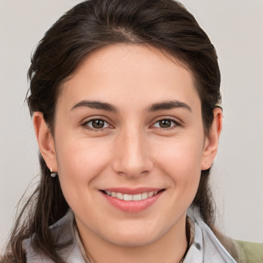 Joyful white young-adult female with medium  brown hair and brown eyes