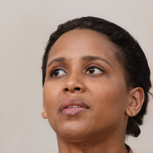Neutral black young-adult female with short  black hair and brown eyes