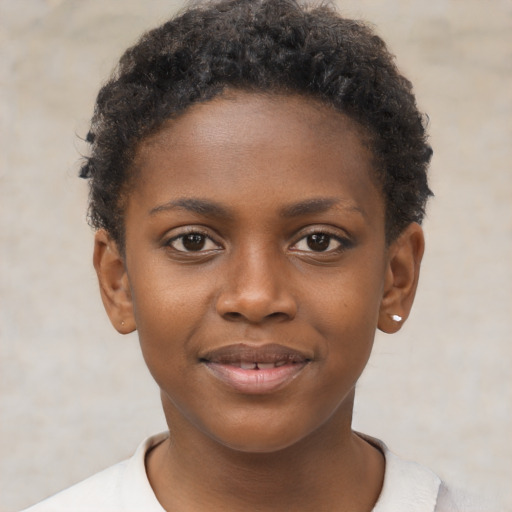 Joyful black child female with short  brown hair and brown eyes