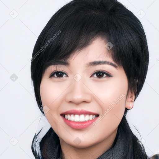 Joyful asian young-adult female with medium  black hair and brown eyes