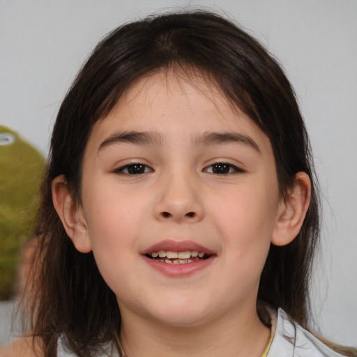 Joyful white child female with medium  brown hair and brown eyes