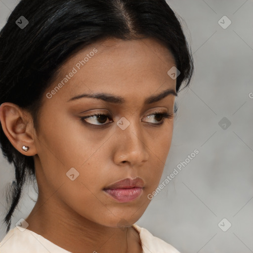 Neutral black young-adult female with medium  brown hair and brown eyes