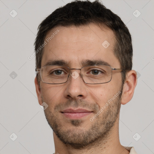 Joyful white adult male with short  brown hair and brown eyes