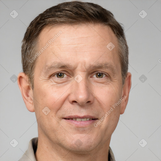 Joyful white adult male with short  brown hair and brown eyes