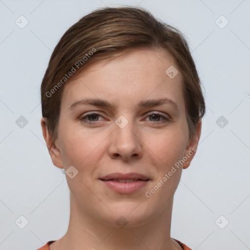 Joyful white young-adult female with short  brown hair and grey eyes