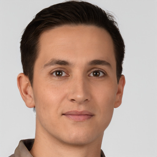 Joyful white young-adult male with short  brown hair and brown eyes