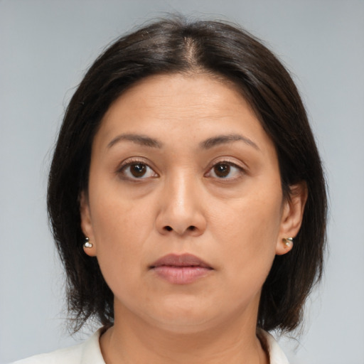 Neutral asian young-adult female with medium  brown hair and brown eyes
