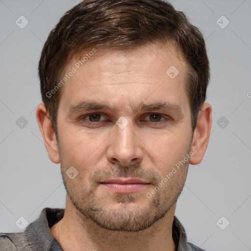 Joyful white adult male with short  brown hair and brown eyes